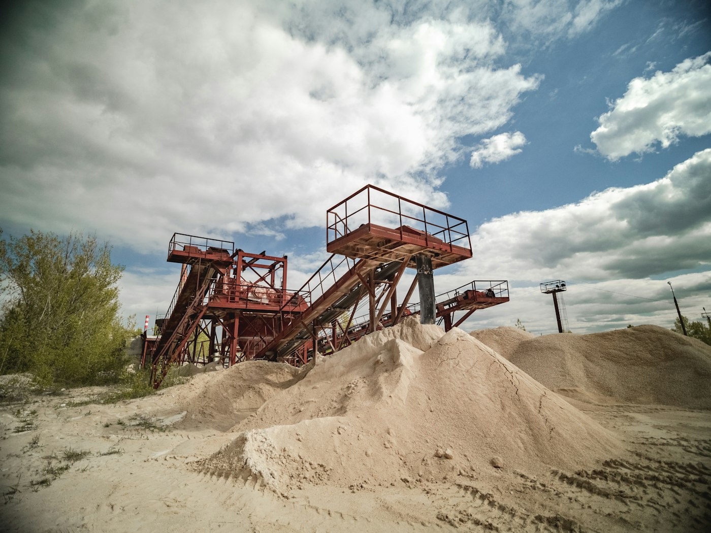 M-sand stockpile and screening plant at a crusher